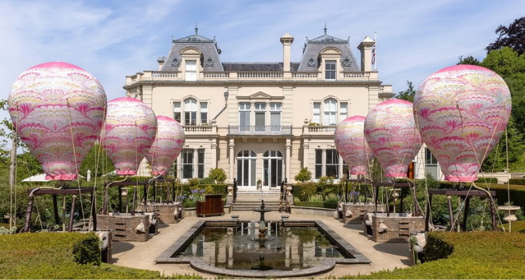 Pink Small Hot Air Balloons Floating Above Dining Tables At The Beaverbrook Hotel.