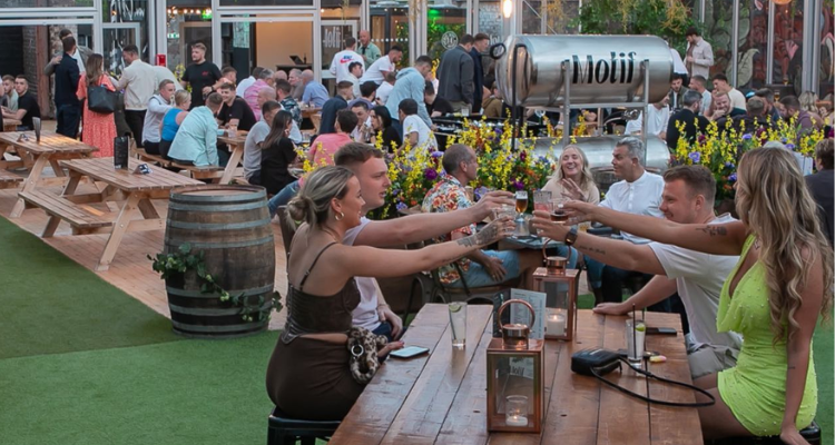 People drinking outdoors at Motif Aberdeen.