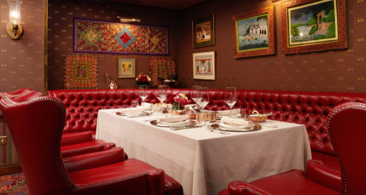 Red interiors of The Curry Room at Rubens at the Palace Hotel.