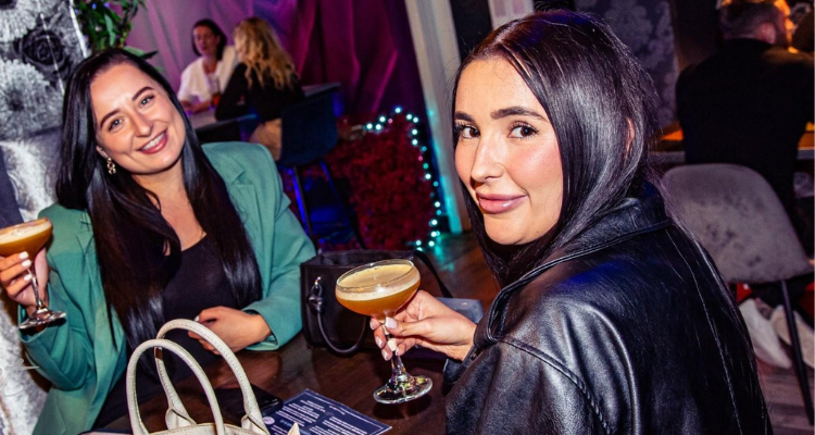 Two girls drinking at Velvet Northampton.