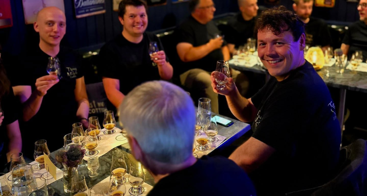 People doing a whisky tasting at Tipsy Midgie Edinburgh.