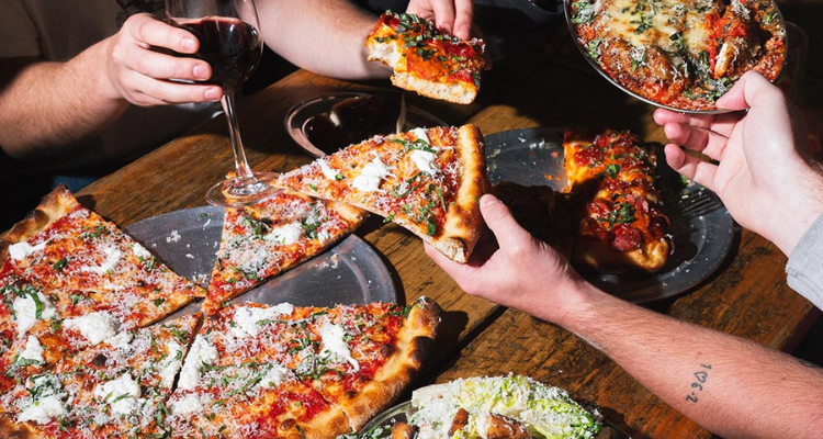 Bad Boy Pizza Society pizzas being eaten.