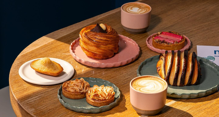 Pastries and coffee on a table from Miel Bakery in London.