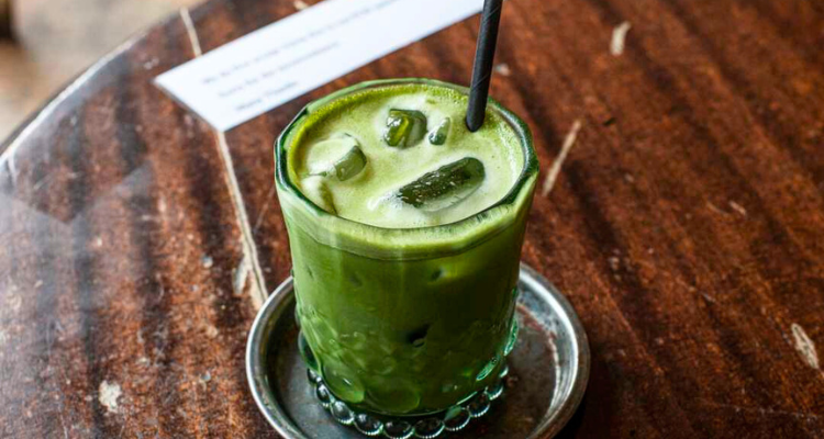 Moko Made Cafe iced matcha on table.