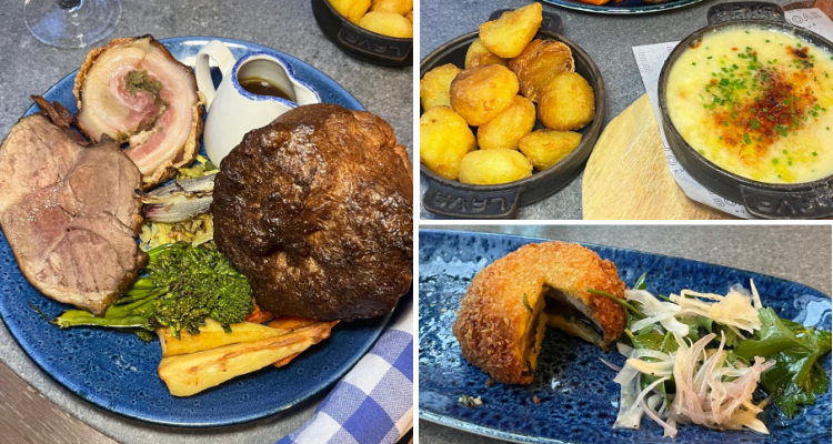 Roast dinner at Blue Boar Post, featuring roast porchetta and lamb leg, as well as roast potatoes, vegetables Yorkshire pudding and cauliflower cheese.