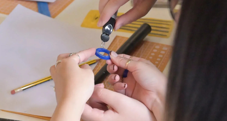 Someone sizing a ring at Wild Fawn in London.