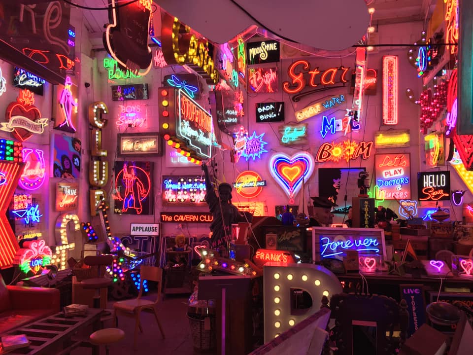 Glowing neon signs inside God's Own Junkyard in Walthamstow.
