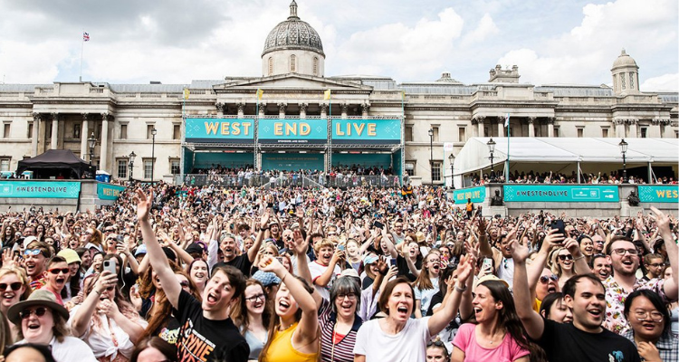 A large crowd gathered at Trafalgar Square dancing for the camera.