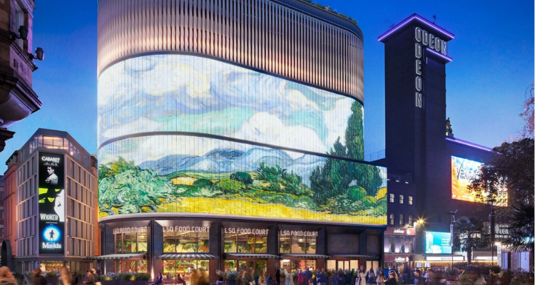A massive building with LED screens at dusk. 