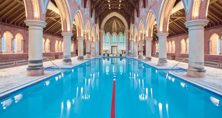 A long pool inside of an old church.