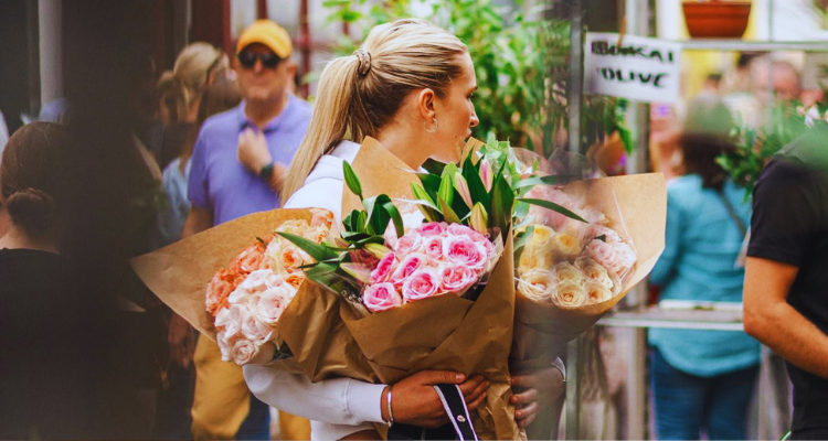 Girl with flowers at Columbia Road.