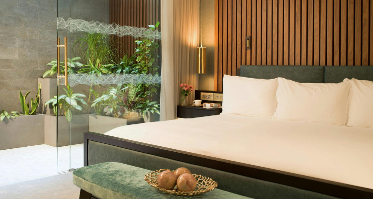 Middle Eight Hotel Covent Garden's nature, earthy-toned rooms, with a giant sized bed.