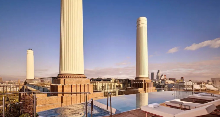 A rooftop pool overlooking Battersea Power Station.