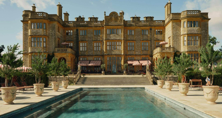 A sprawling manor with a swimming pool.