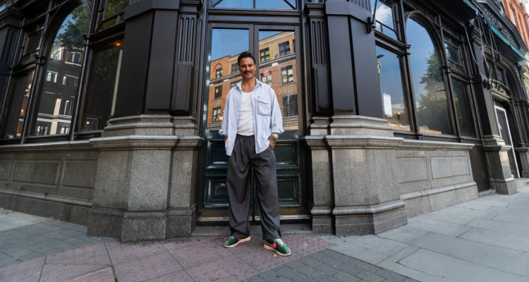 Marc Francis-Baum standing in front of George & Dragon in Clerkenwell.