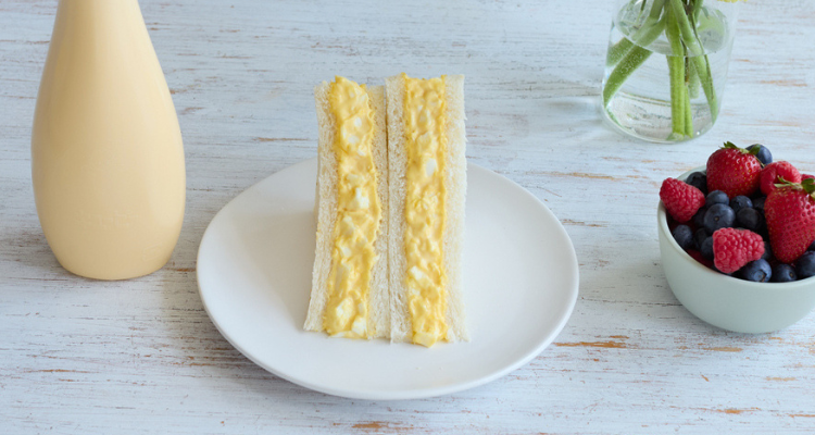 Kewpie may sandwich on a table.