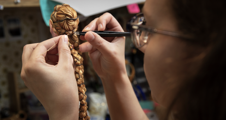 Girl making an animations braided hair.