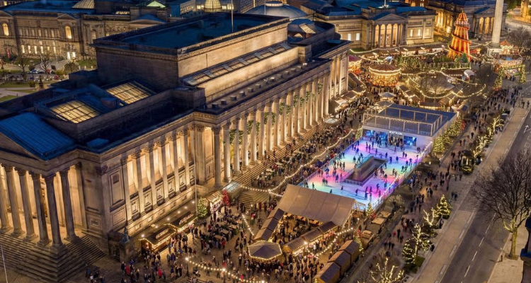 A mock up of this year's Liverpool Christmas Market with twinkling lights, an ice rink, and fair ground rides.