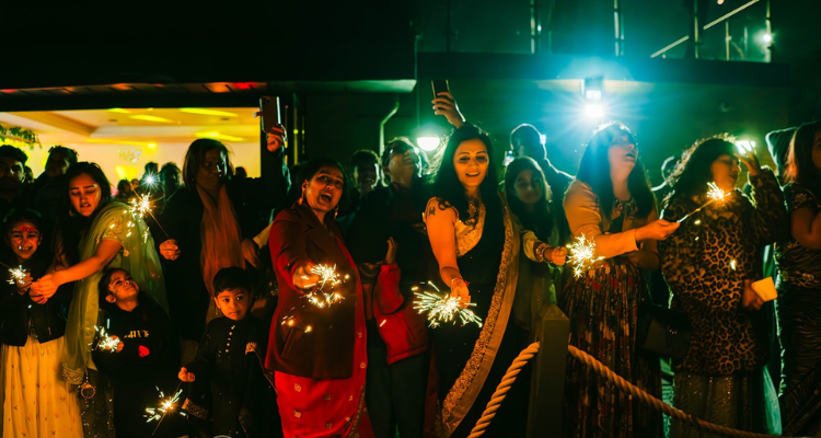 People celebrating Diwali with sparklers.