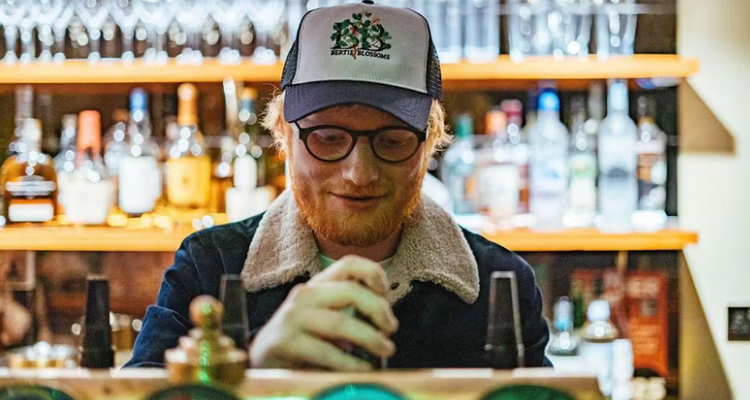 Ed Sheeran behind the bar, pouring a pint at Bertie Blossoms.