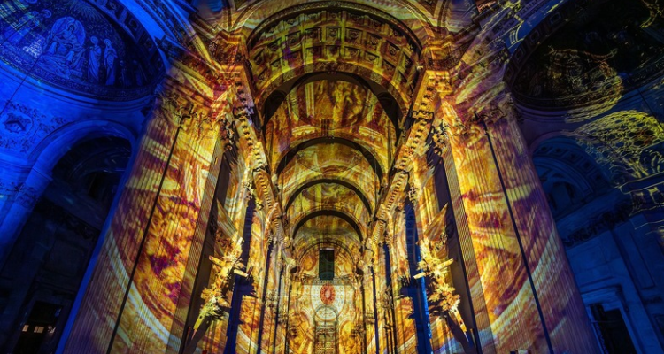 St Paul's cathedral with light projections on it.